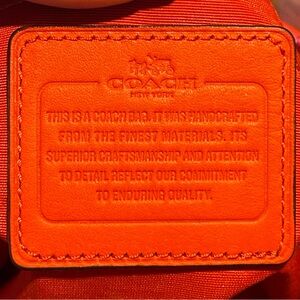 Tan and Red medium sized Coach bag